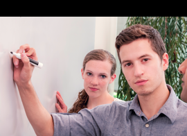 Students writing on a board